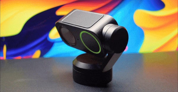 Animation of the Insta360 Link 2 4k webcam turning on its dual axis with the camera lens auto focusing.