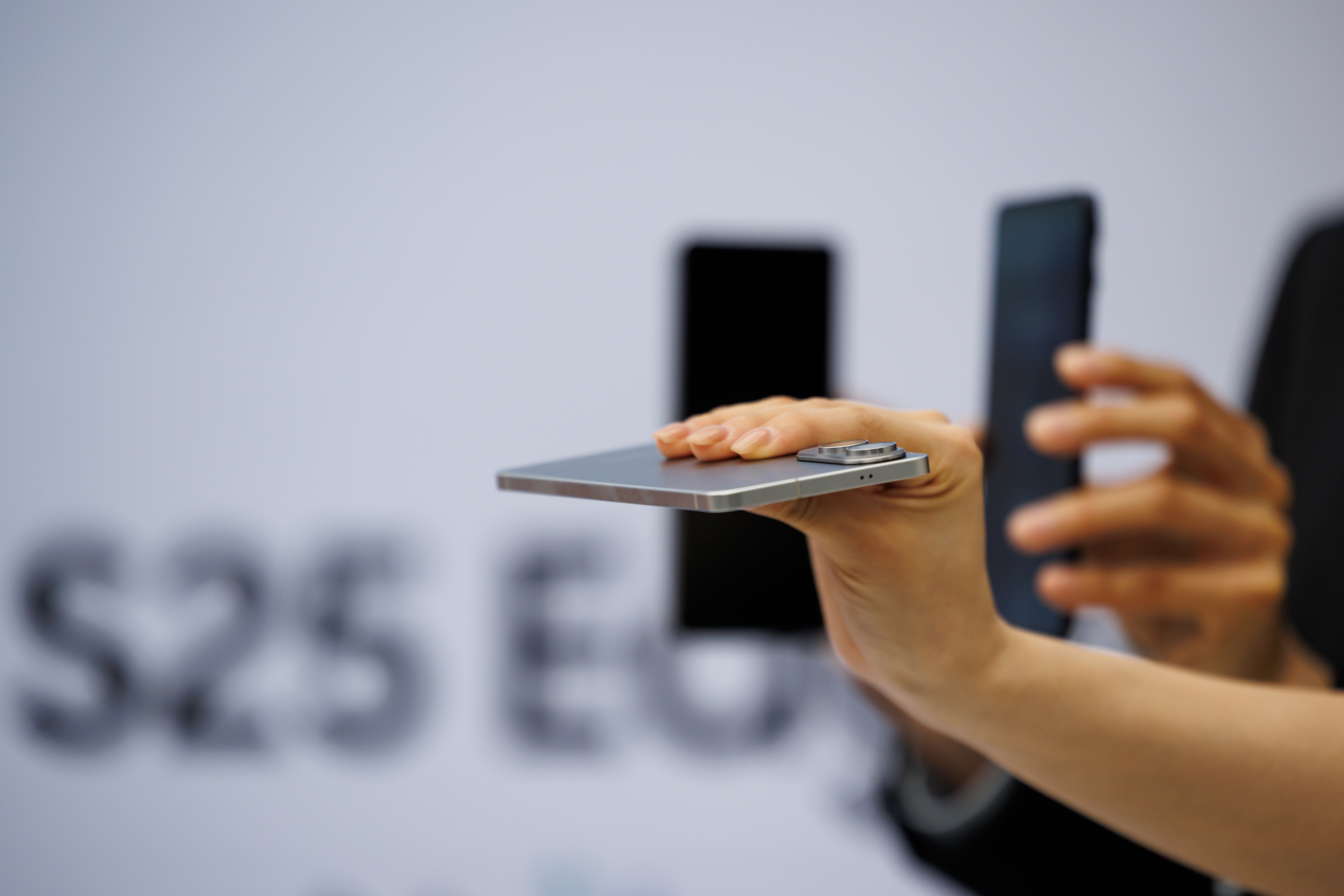 Samsung Galaxy S25 Edge smartphones during a launch event in Seoul, South Korea, on Tuesday, May 13, 2025. Samsung Electronics Co.'s latest device, which goes on sale in the US on May 30 for $1,099, is 5.8 millimeters thick and weighs 163 grams, making it about 30% thinner and 25% lighter than the S25 Ultra, the company's highest-end smartphone. Photographer: SeongJoon Cho/Bloomberg via Getty Images
