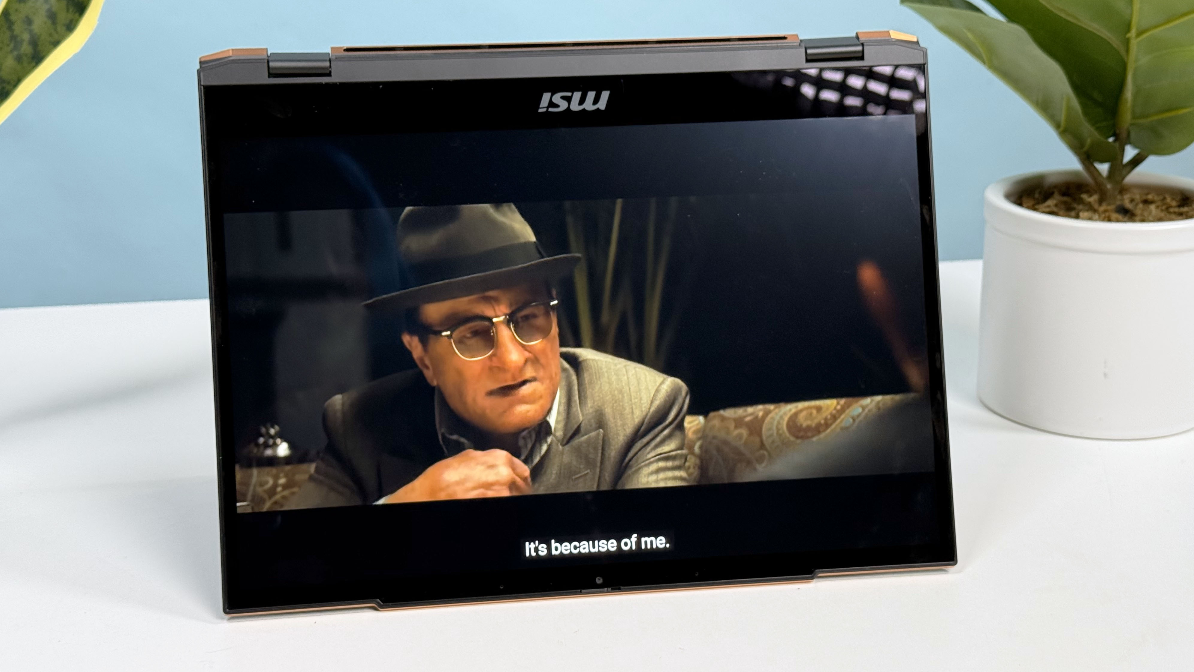 MSI Summit 13 AI+ Evo (A2VM) 2-in-1 laptop stood up on a desk with only its display visible.