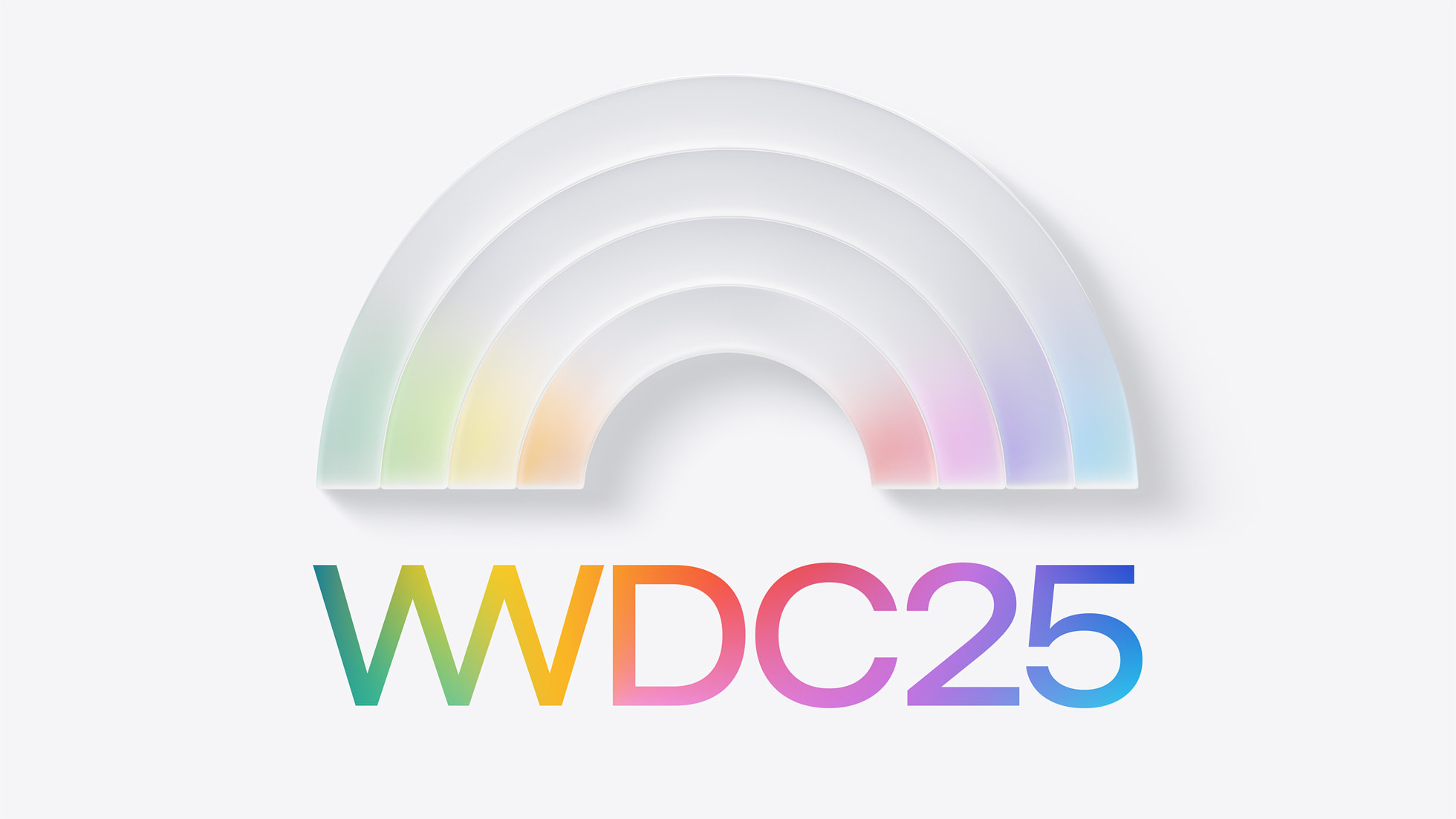 The WWDC 2025 logo, which shows "WWDC 2025" colored with a rainbow gradient and a glass-looking rainbow above the text that is slowly filling with color.