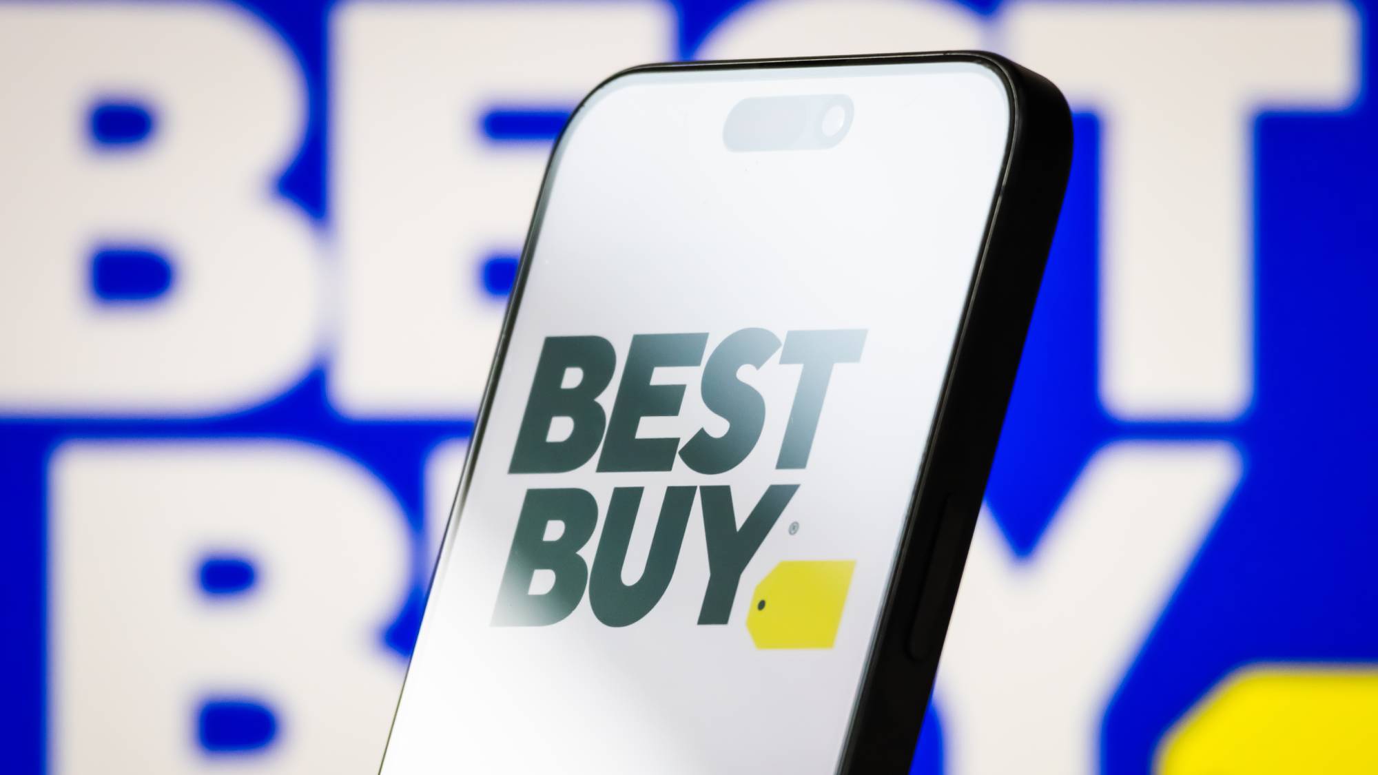 Best Buy logo with white background on a smartphone against a blue background Best Buy logo