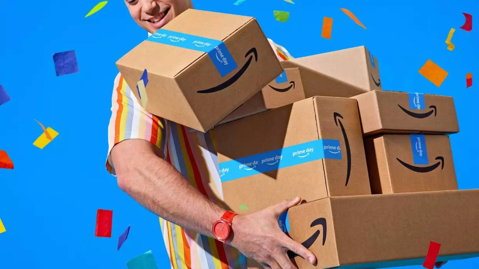 Amazon Prime Day 2025 - Man holding Prime Day boxes against blue background