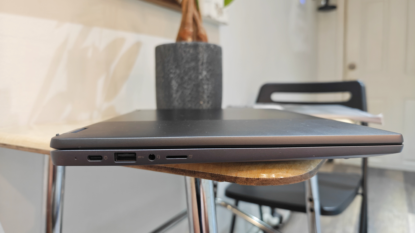 Sideview photo of Lenovo IdeaPad Flex 5i Chromebook Plus showing ports and overall thinness