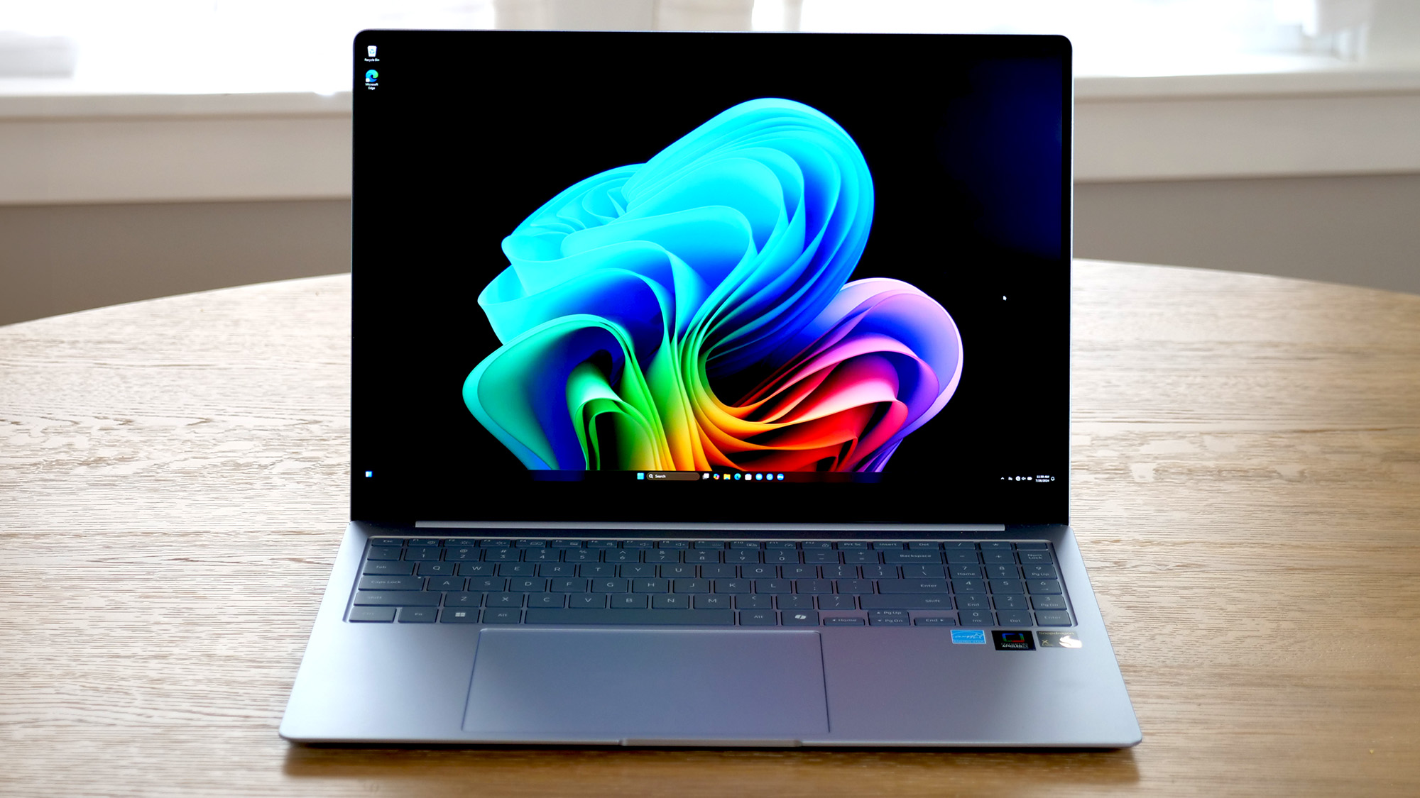 LG Gram Pro 16 2-in-1 (16T90SP) open on a wooden table