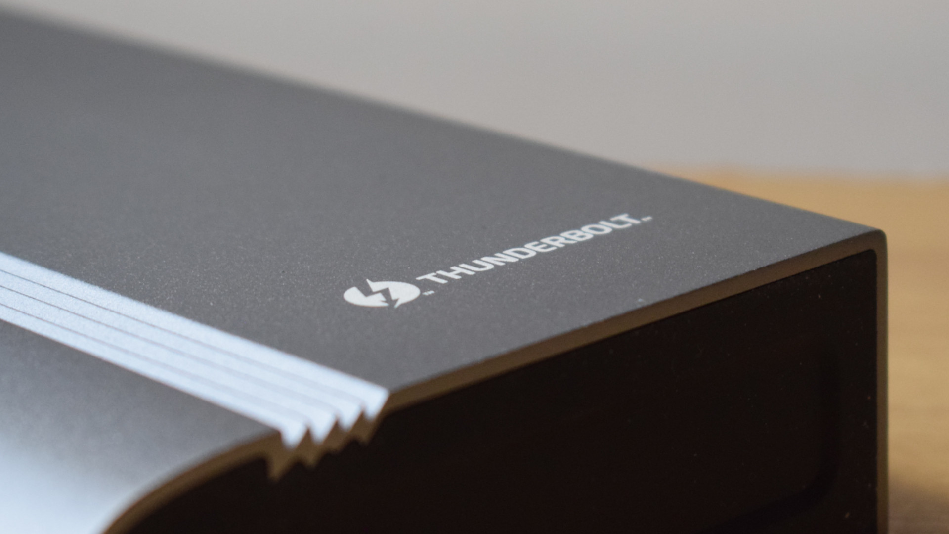 Close-up photo of the Plugable Thunderbolt 4 & USB4 Quad Display Docking Station (TBT4-UDZ) showing the grille design and Thunderbolt branding.