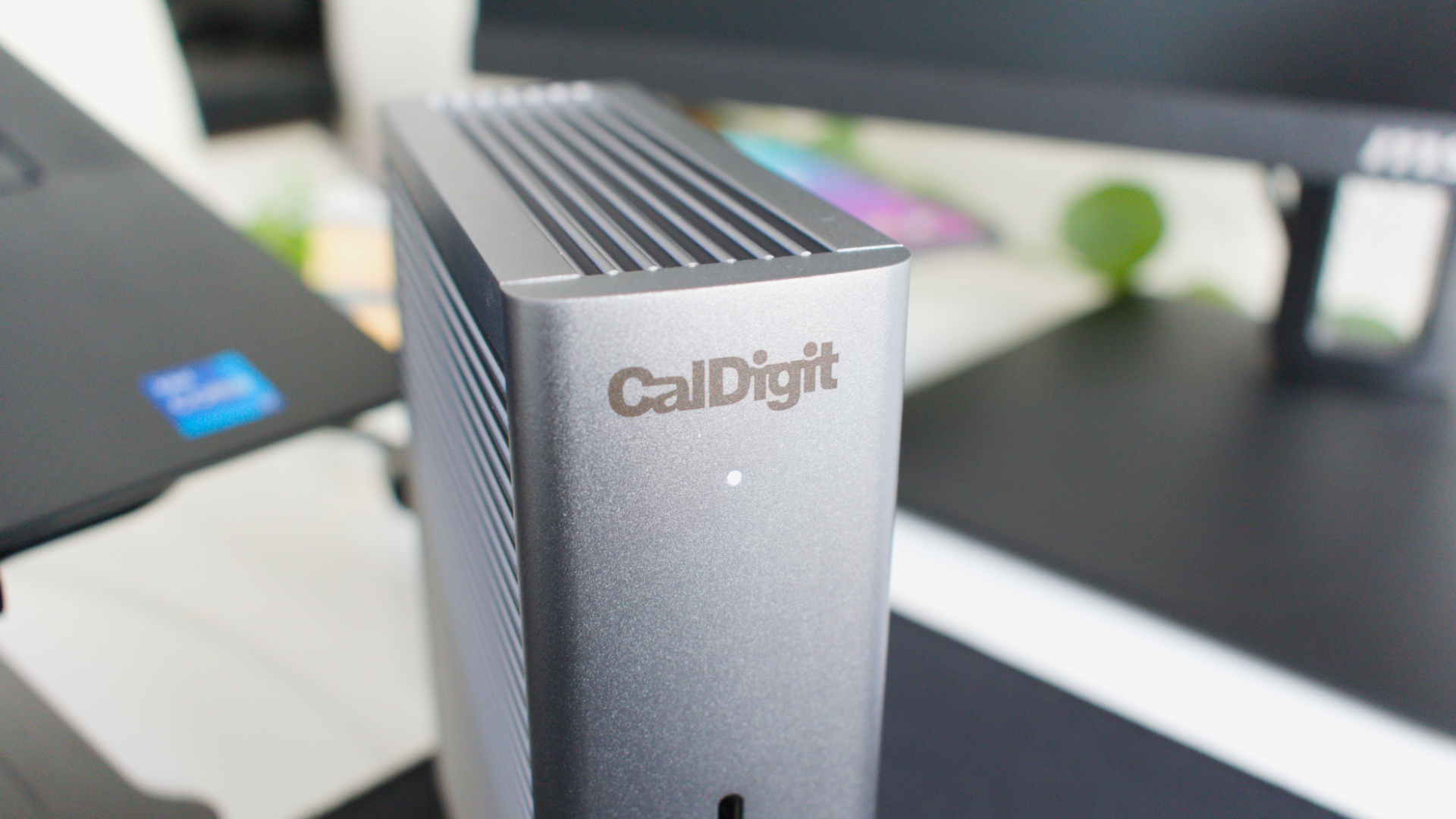 Close-up photo of the CalDigit Thunderbolt Station 4 docking station showing the CalDigit branding, grilled design, and power light.